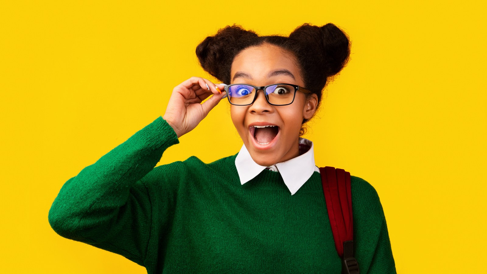 Smiling sitter adjusting her glasses